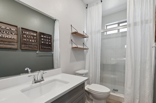 11289 N Alicante Dr, Fresno, CA 93730 - bathroom featuring a stall shower, toilet, and vanity