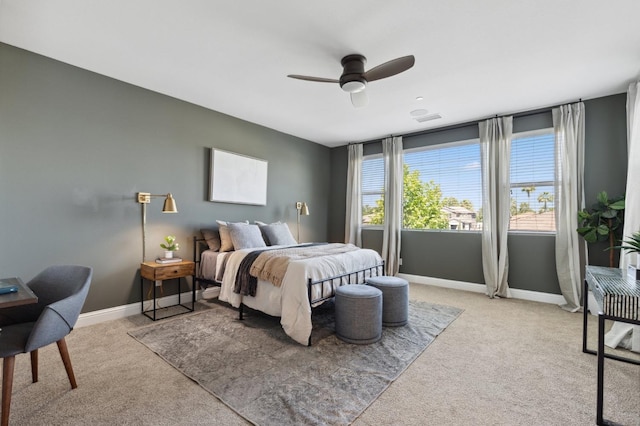 11289 N Alicante Dr, Fresno, CA 93730 - bedroom featuring light carpet, baseboards, and a ceiling fan
