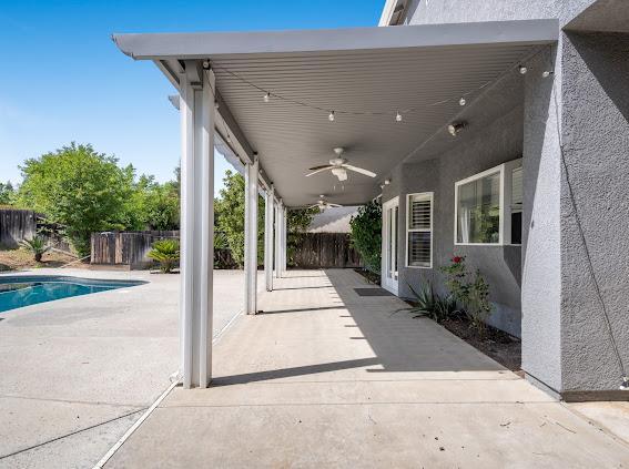 view of patio with a ceiling fan and a fenced backyard