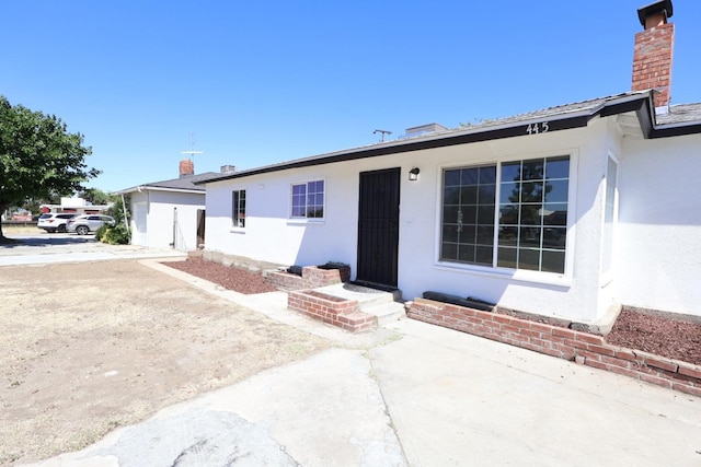 445 Shaw Ave, Clovis, CA 93612 - single story home with a chimney and stucco siding