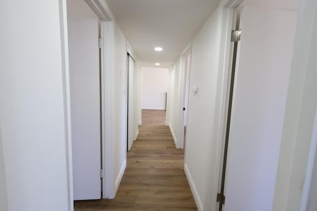 445 Shaw Ave, Clovis, CA 93612 - corridor with baseboards, wood finished floors, and recessed lighting