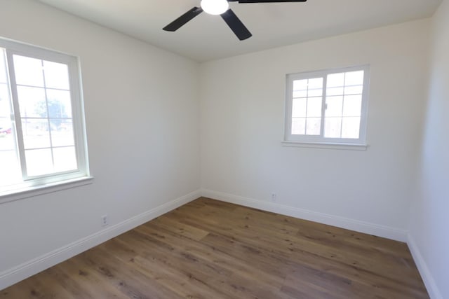 445 Shaw Ave, Clovis, CA 93612 - unfurnished room with healthy amount of natural light, baseboards, and wood finished floors