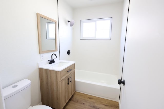 445 Shaw Ave, Clovis, CA 93612 - full bath with toilet, wood finished floors, vanity, and shower / washtub combination