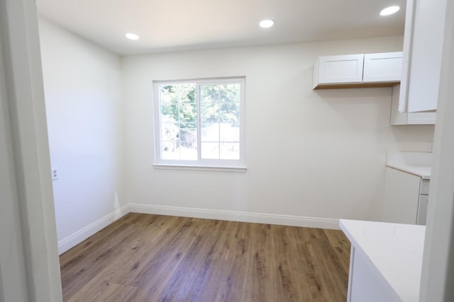 445 Shaw Ave, Clovis, CA 93612 - unfurnished dining area with light wood-style flooring, baseboards, and recessed lighting