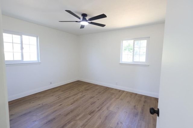 445 Shaw Ave, Clovis, CA 93612 - unfurnished room featuring wood finished floors, baseboards, and a ceiling fan