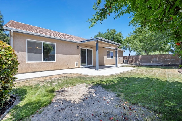 back of house with stucco siding, a patio, and central air condition unit
