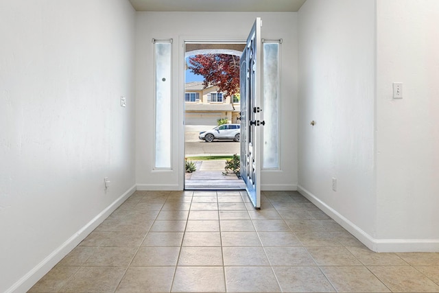 6254 E Bellaire Way, Fresno, CA 93727 - foyer featuring light tile patterned floors and baseboards