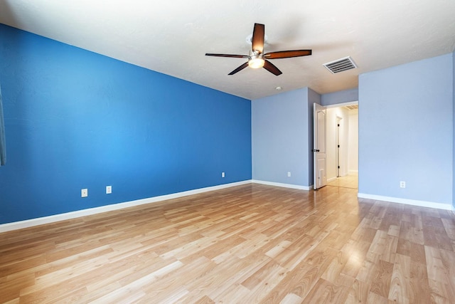 unfurnished room featuring light wood finished floors, a ceiling fan, and baseboards