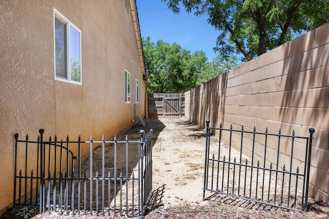 6254 E Bellaire Way, Fresno, CA 93727 - view of property exterior with a gate and stucco siding