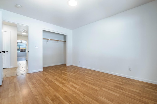 6254 E Bellaire Way, Fresno, CA 93727 - unfurnished bedroom with light wood finished floors and a closet