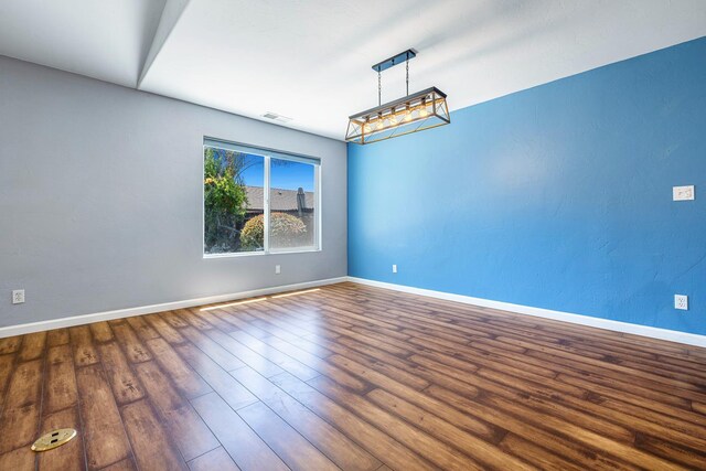 6254 E Bellaire Way, Fresno, CA 93727 - spare room featuring wood finished floors and baseboards
