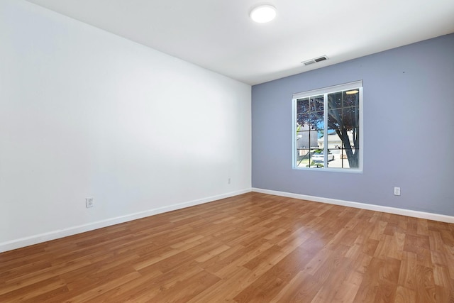 6254 E Bellaire Way, Fresno, CA 93727 - spare room featuring light wood-type flooring and baseboards