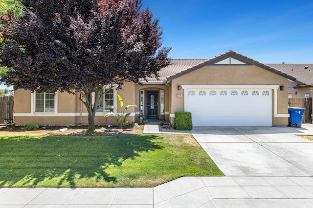 6254 E Bellaire Way, Fresno, CA 93727 - ranch-style home with stucco siding, a garage, driveway, and a tile roof