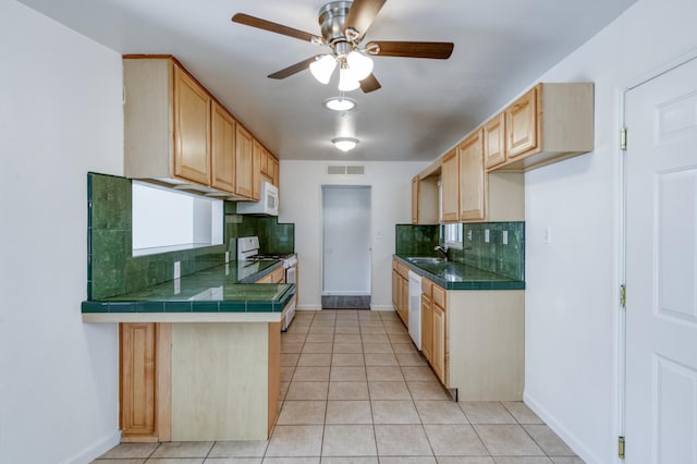 5535 N Millbrook Ave, Fresno, CA 93710 - kitchen featuring white appliances, a sink, tasteful backsplash, a ceiling fan, and light tile patterned floors