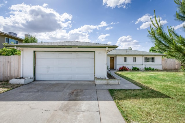5535 N Millbrook Ave, Fresno, CA 93710 - single story home featuring concrete driveway, stucco siding, and a garage