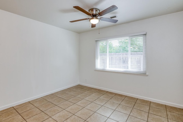 5535 N Millbrook Ave, Fresno, CA 93710 - unfurnished room featuring ceiling fan, baseboards, and light tile patterned flooring