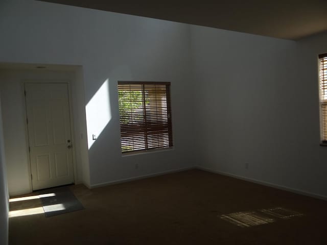 309 Pine Ct, Chowchilla, CA 93610 - carpeted foyer entrance with healthy amount of natural light and baseboards