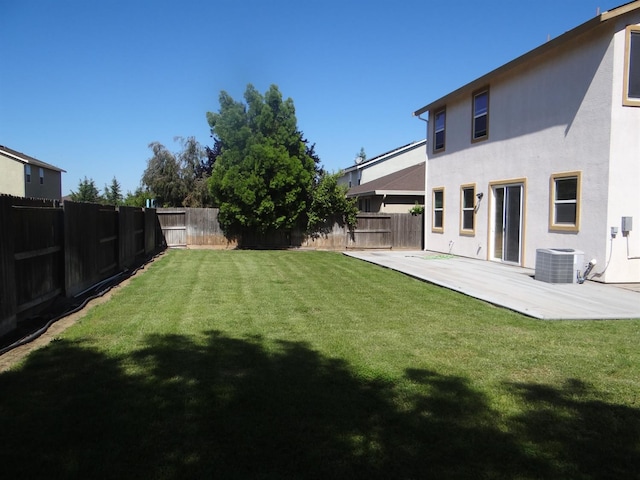 view of yard featuring central AC and a patio area