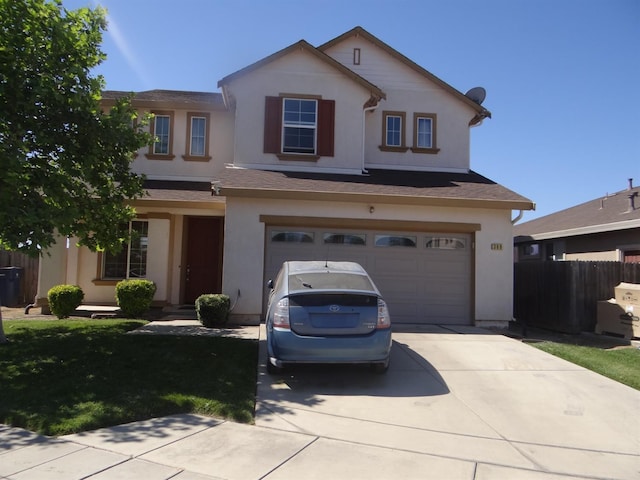 traditional home with concrete driveway, a garage, and stucco siding