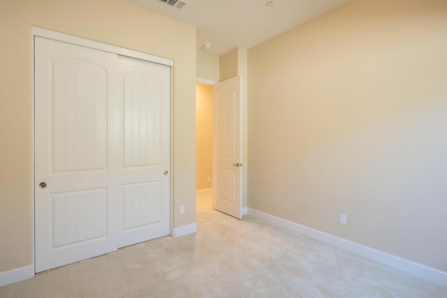 3636 Elberta Cir, Dinuba, CA 93618 - unfurnished bedroom featuring light colored carpet, a closet, and baseboards