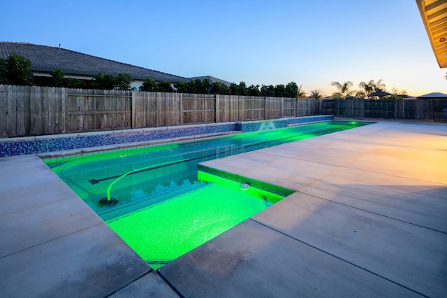 3636 Elberta Cir, Dinuba, CA 93618 - pool at dusk with a fenced backyard and a patio area