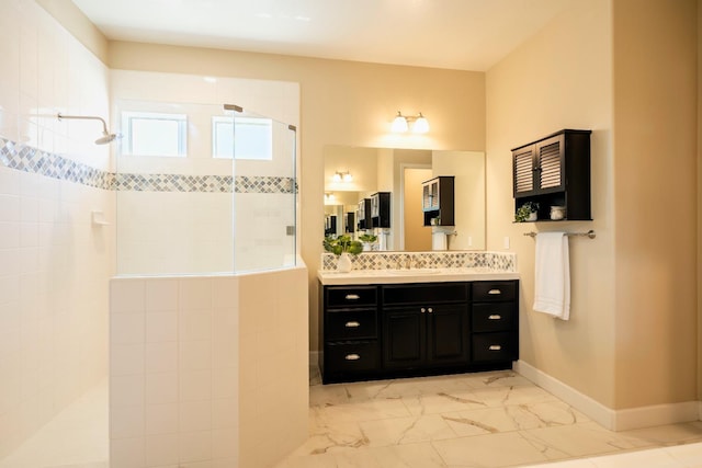3636 Elberta Cir, Dinuba, CA 93618 - bathroom with a walk in shower, marble look tiles, vanity, and baseboards