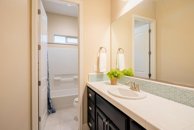 3636 Elberta Cir, Dinuba, CA 93618 - bathroom with vanity, toilet, tile patterned floors, shower / bath combo, and backsplash