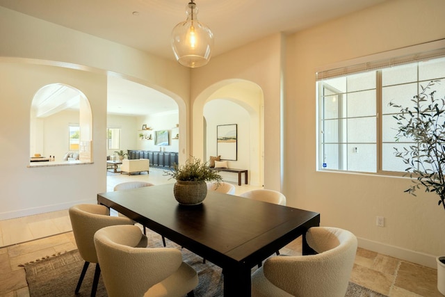 3636 Elberta Cir, Dinuba, CA 93618 - dining space featuring arched walkways and baseboards