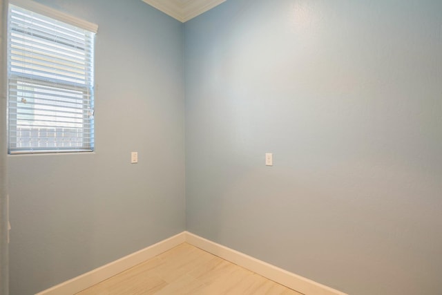 3636 Elberta Cir, Dinuba, CA 93618 - empty room featuring light wood-style flooring, baseboards, and crown molding