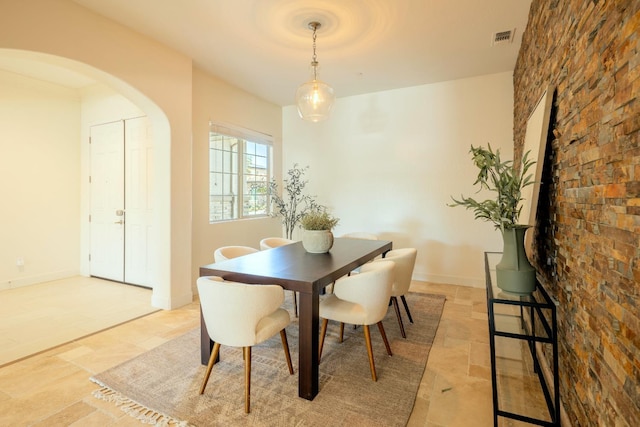 3636 Elberta Cir, Dinuba, CA 93618 - dining area with arched walkways and stone tile flooring