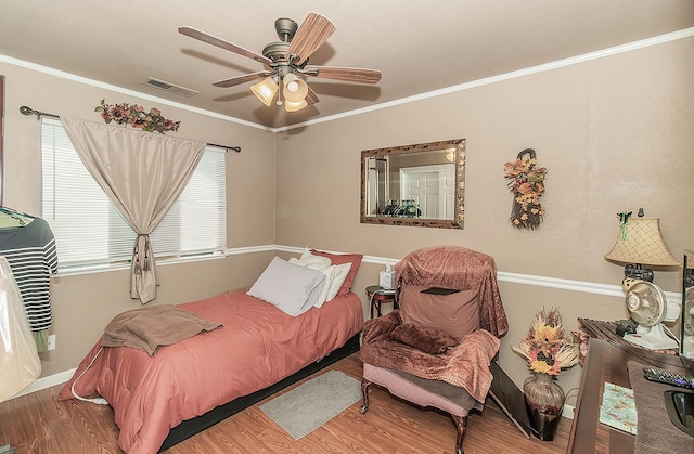 3732 W Garland Ave, Fresno, CA 93722 - bedroom with wood finished floors, ornamental molding, baseboards, and ceiling fan