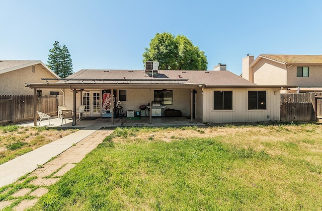 3732 W Garland Ave, Fresno, CA 93722 - back of house with a patio area, a chimney, and french doors