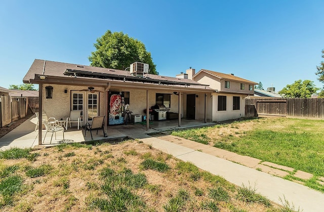 3732 W Garland Ave, Fresno, CA 93722 - rear view of house featuring central AC, a patio area, and stucco siding