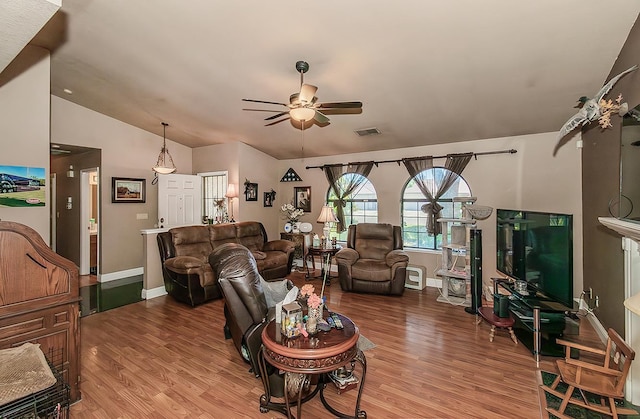 3732 W Garland Ave, Fresno, CA 93722 - living room with a ceiling fan, vaulted ceiling, wood finished floors, and baseboards