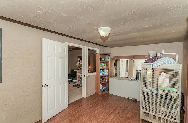 3732 W Garland Ave, Fresno, CA 93722 - empty room featuring a textured wall, wood finished floors, and a textured ceiling