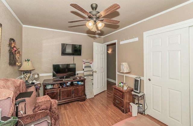 3732 W Garland Ave, Fresno, CA 93722 - living room with wood finished floors, ceiling fan, and ornamental molding