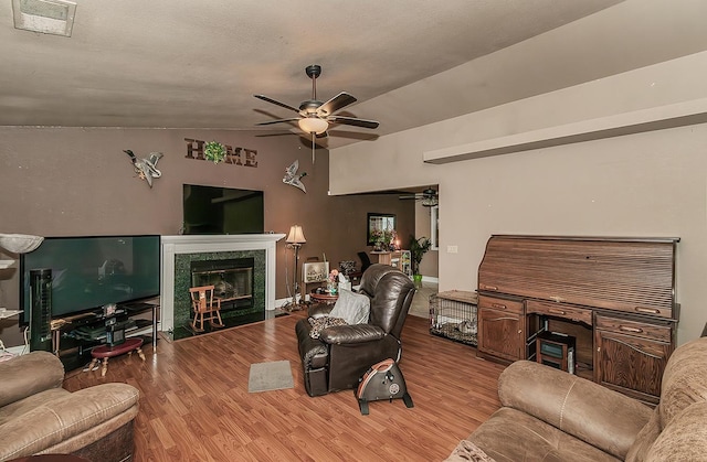 3732 W Garland Ave, Fresno, CA 93722 - living area with a ceiling fan, wood finished floors, lofted ceiling, and a high end fireplace