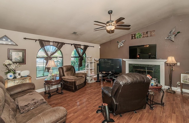 3732 W Garland Ave, Fresno, CA 93722 - living area featuring vaulted ceiling, a ceiling fan, wood finished floors, a fireplace, and baseboards