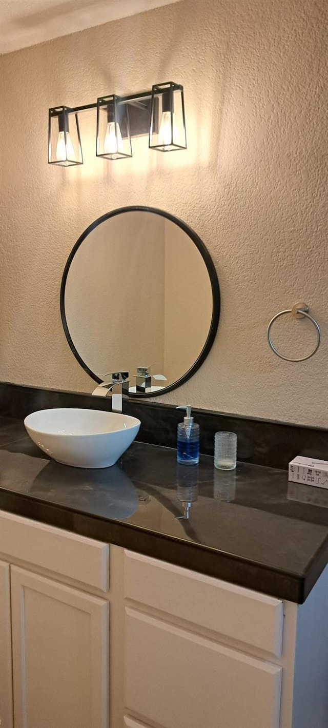 1690 W Wall Ln, Porterville, CA 93257 - bathroom with vanity and a textured wall