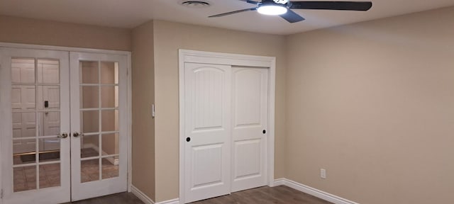 1690 W Wall Ln, Porterville, CA 93257 - unfurnished bedroom with french doors, dark wood finished floors, baseboards, and a closet
