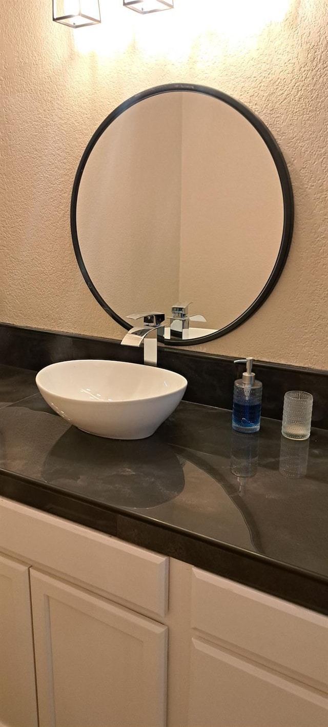 1690 W Wall Ln, Porterville, CA 93257 - bathroom featuring vanity and a textured wall