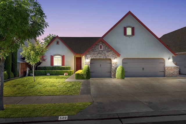 520 W Warwick, Clovis, CA 93619 - view of front of property with stone siding, stucco siding, and a front lawn