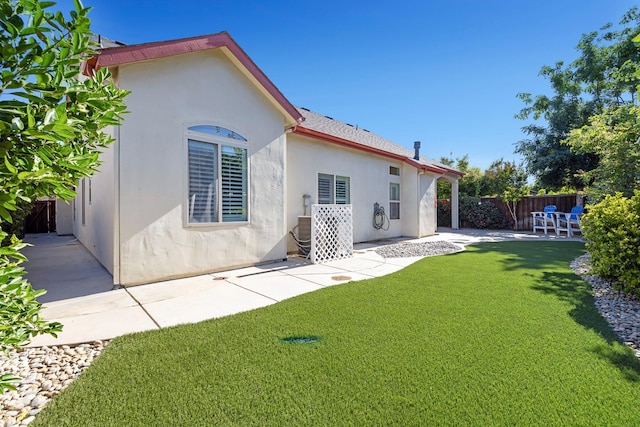 520 W Warwick, Clovis, CA 93619 - rear view of house with a patio area and stucco siding