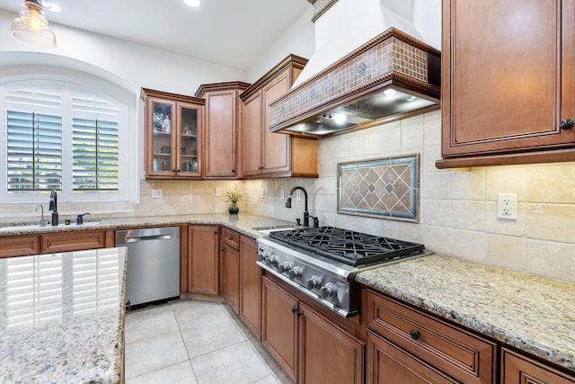 520 W Warwick, Clovis, CA 93619 - kitchen with appliances with stainless steel finishes, premium range hood, a sink, and light stone countertops