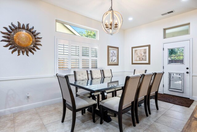 520 W Warwick, Clovis, CA 93619 - dining room featuring a chandelier, plenty of natural light, and baseboards