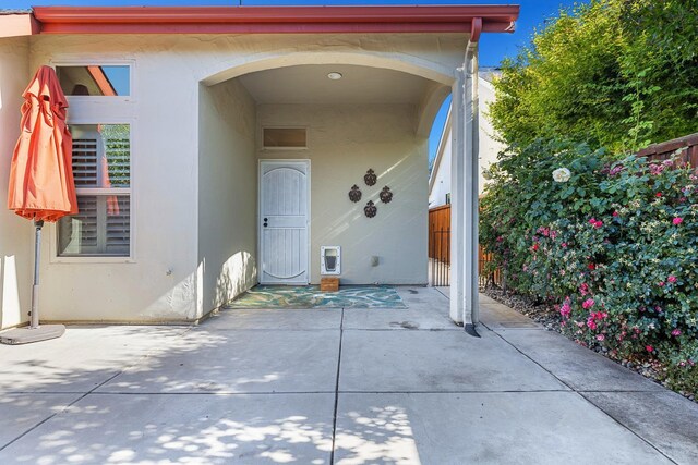 520 W Warwick, Clovis, CA 93619 - view of exterior entry featuring stucco siding and a patio