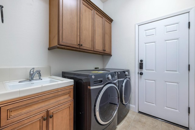 520 W Warwick, Clovis, CA 93619 - laundry area featuring cabinet space, independent washer and dryer, and light tile patterned flooring