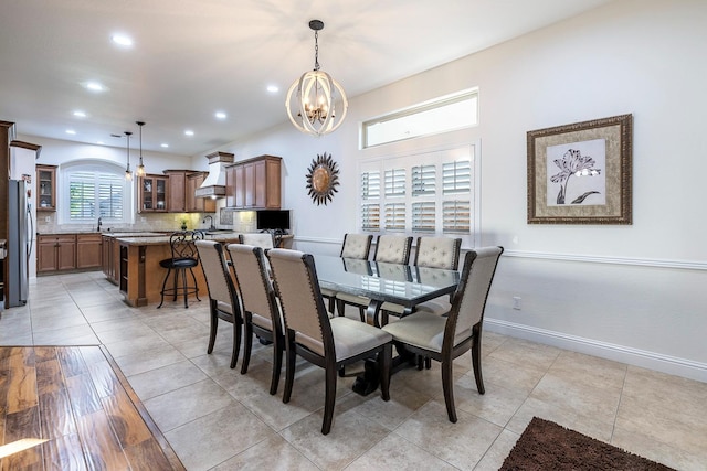 520 W Warwick, Clovis, CA 93619 - dining space with a chandelier, light tile patterned floors, recessed lighting, and baseboards