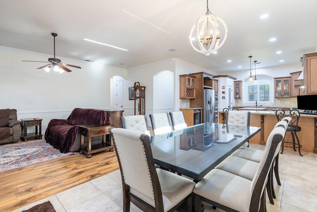 520 W Warwick, Clovis, CA 93619 - dining room with arched walkways, a chandelier, light tile patterned floors, a ceiling fan, and recessed lighting