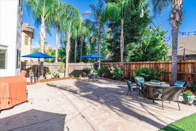 1117 E Royal Dornoch Ave, Fresno, CA 93730 - fenced backyard with outdoor dining area and a patio area